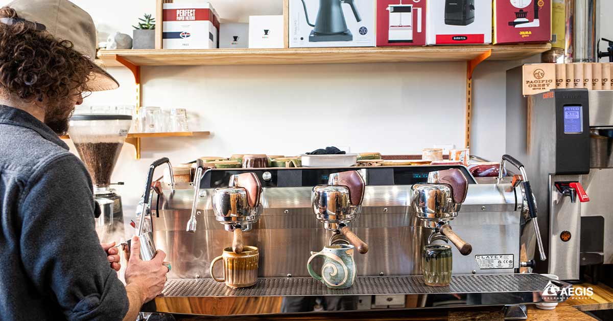 A barista makes espresso drinks at Aegis client, Pacific Crest Coffee.