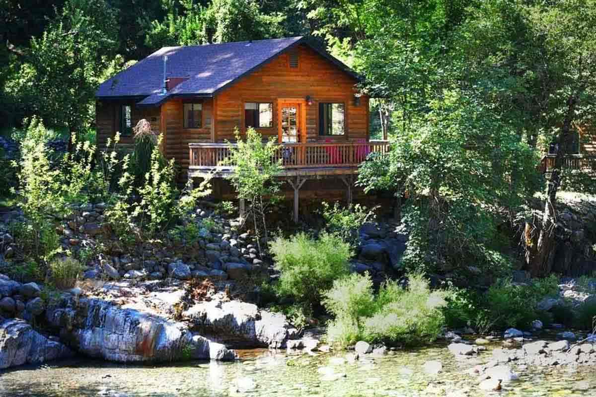 Image of a riverfront cabin at The Lure Resort in Downieville, CA.